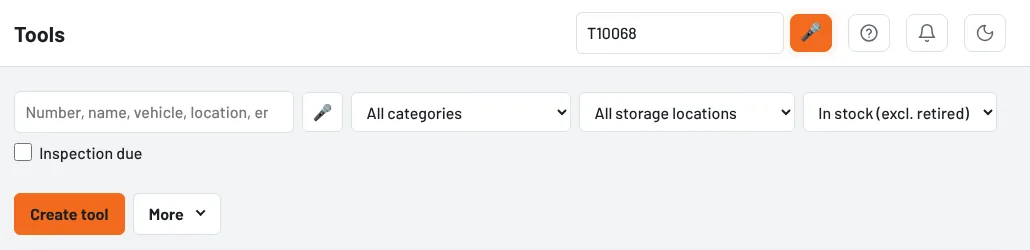 Microphone next to the search field – it lights up orange while recording